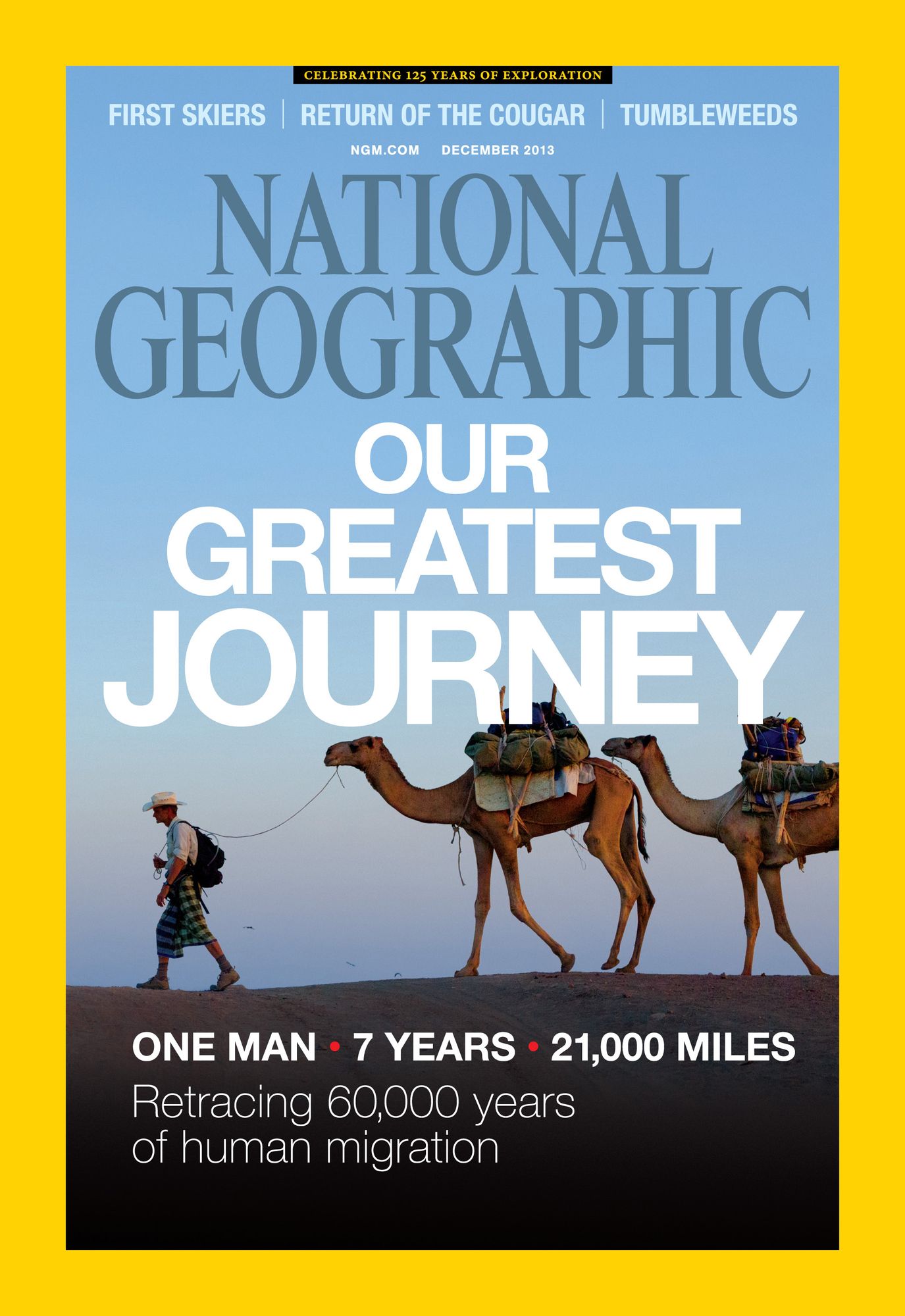 National Geographic magazine cover showing person walking in front of two camels carrying bags